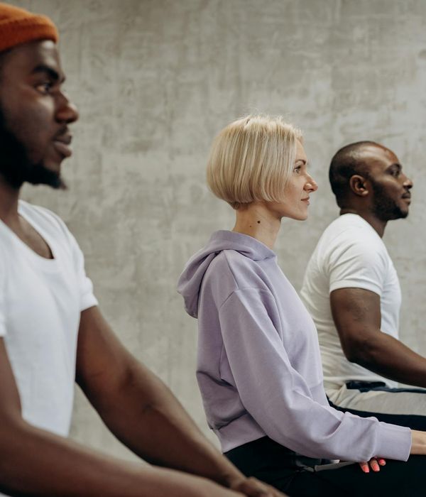 A diverse group of people feeling relaxed after a yoga session.